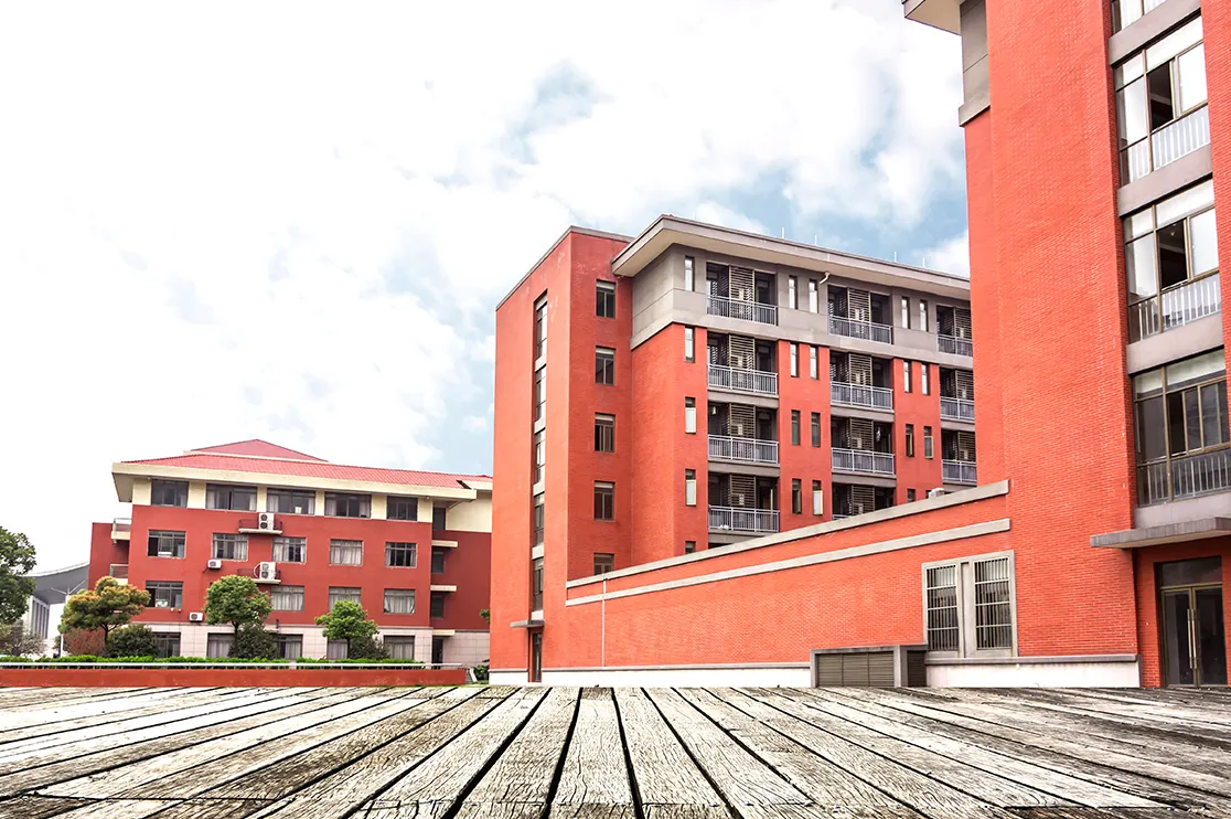A modern educational facility with multiple school buildings, landscaped outdoor areas, and interconnected spaces. The image represents how BIM supports school building design, planning, coordination, and construction